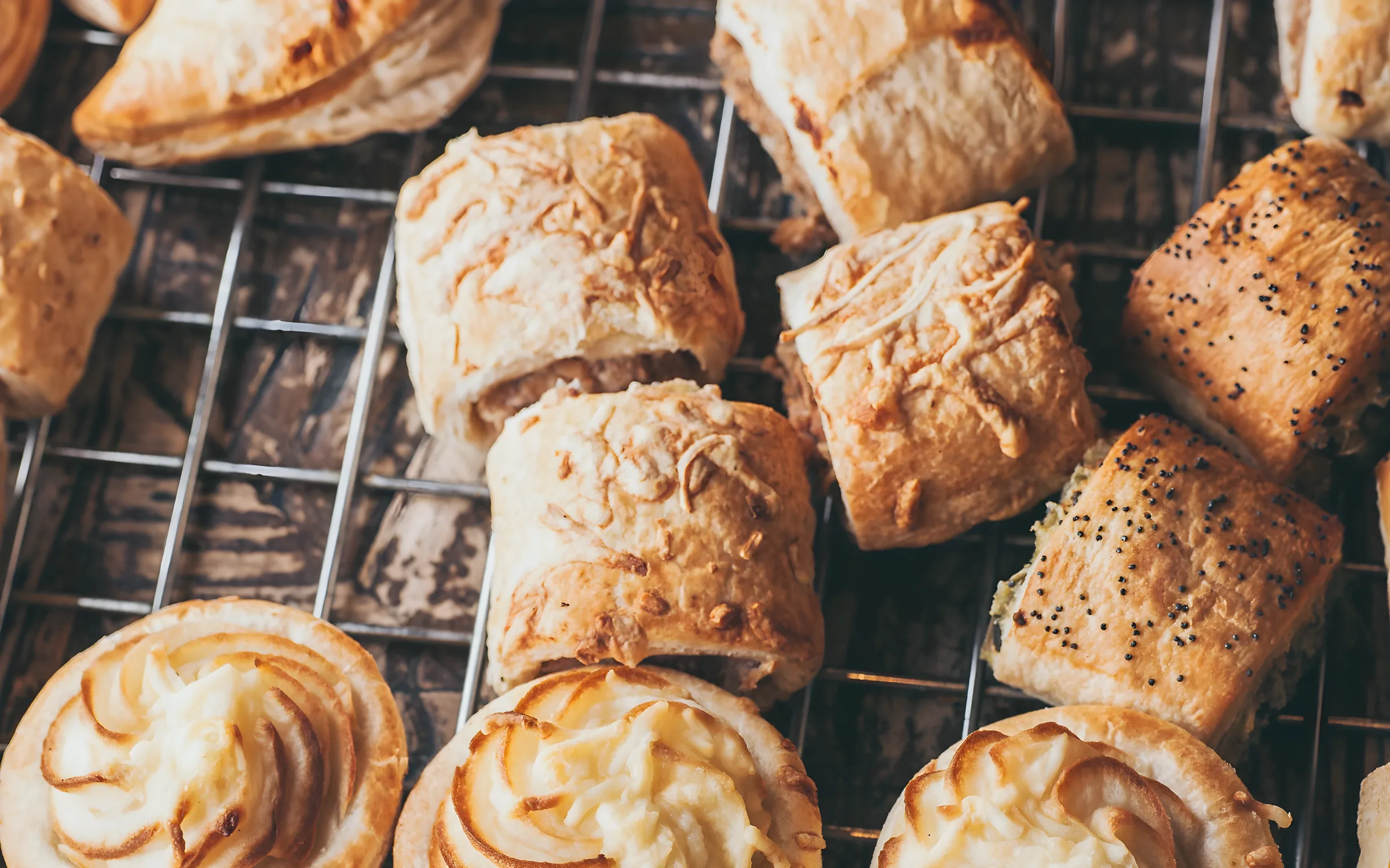 Sausage rolls and pastries cooling on a rack at Bakery on O’Connell.
